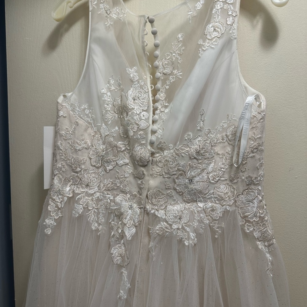Never worn wedding dress. It is Champaign in color. Found something else.